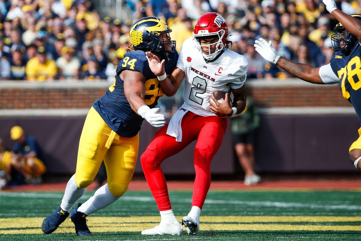 Michigan defensive lineman Kris Jenkins (94) sacks UNLV quarterback Doug Brumfield (2) during the first half at Michigan Stadium in Ann Arbor on Saturday, Sept. 9, 2023.  